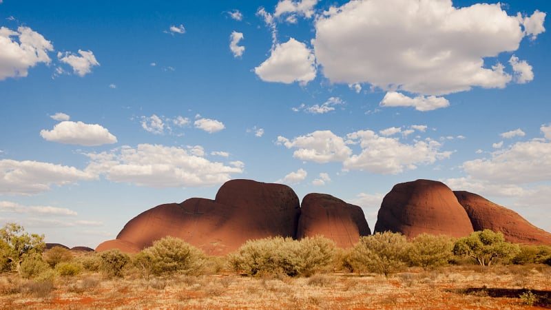 This image features the Kata Tjuṯa rock formations, also known as The Olgas, located within the Uluṟu-Kata Tjuṯa National Park.