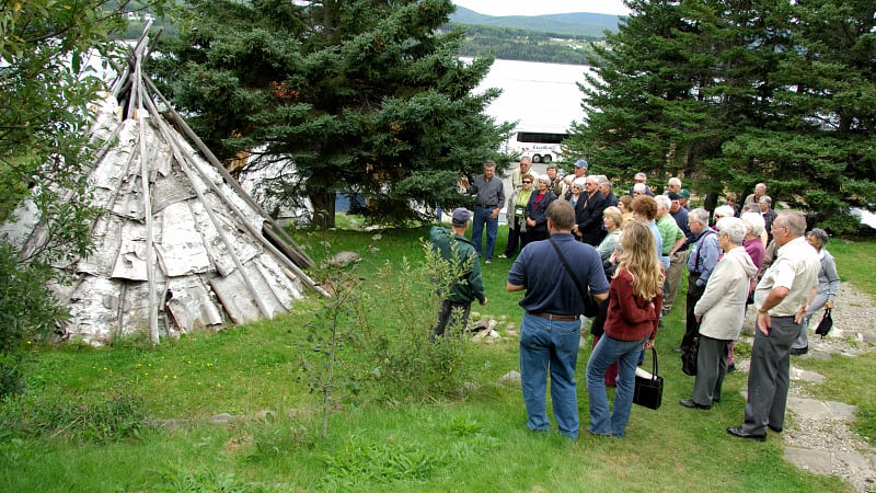 A conical wigwam (or wikuom) covered with sheets of birch bark.