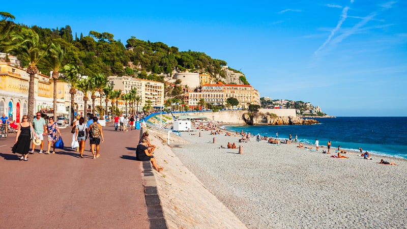 This image features the famous Promenade des Anglais stretching along the Baie des Anges (Bay of Angels) in Nice, France.