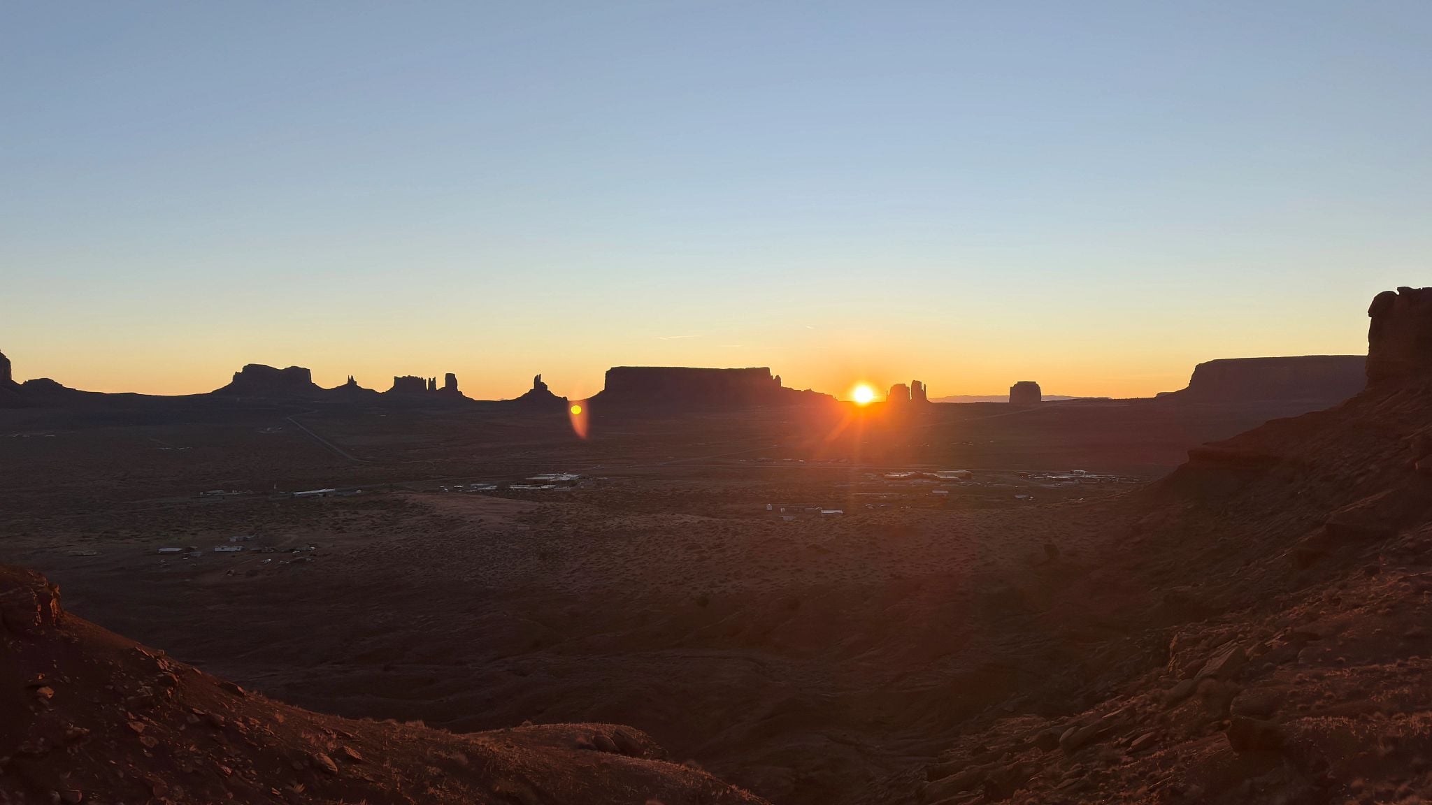 Sun Rising over the Canyon at Monument Valley