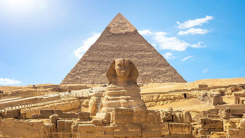 Front view of Sphinx and Khafre pyramid in the desert of Giza, Egypt