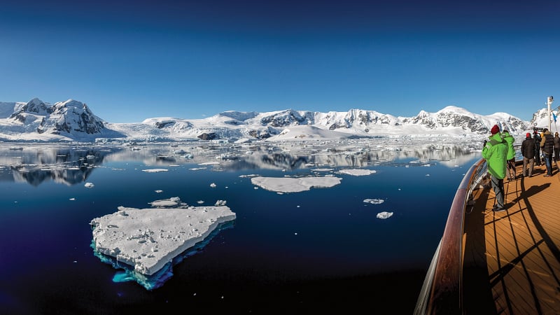 tourists on an expedition cruise ship traveling through Antarctica.