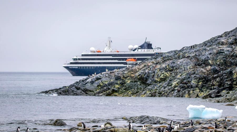 Atlas World Traveler polar expedition ship anchored off the coast of Antarctica.