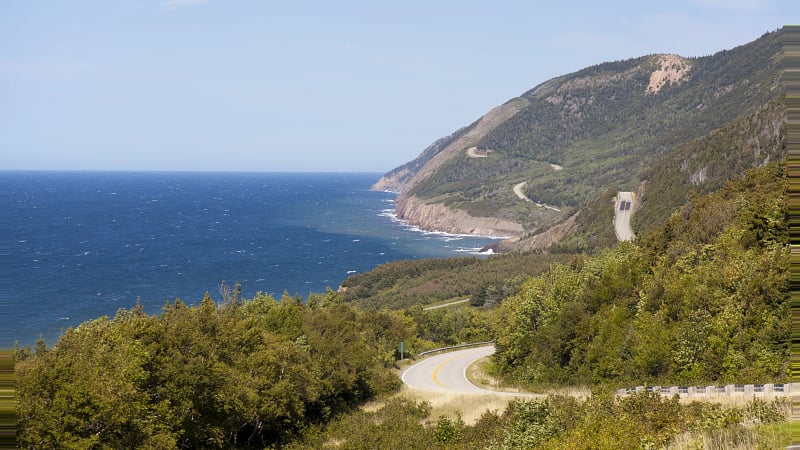 This is the world-famous Cabot Trail winding through Cape Breton Highlands National Park on Cape Breton Island, Nova Scotia, Canada.