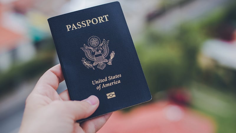 Holding a Passport_227723315_AdobeStockRF.jpeg