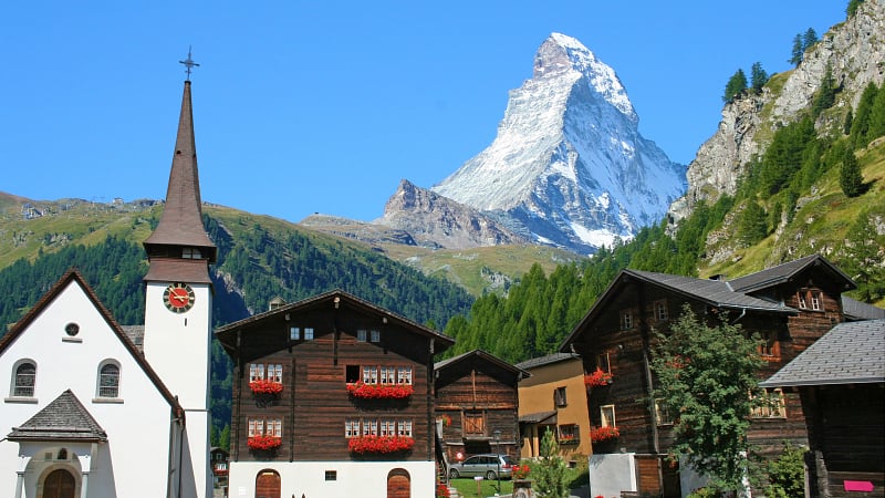 The car-free alpine village of Zermatt, located in the canton of Valais, Switzerland, with the iconic, pyramid-shaped Matterhorn mountain rising majestically in the background