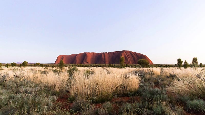Uluru, a massive red sandstone monolith located in the heart of Australia's Northern Territory.