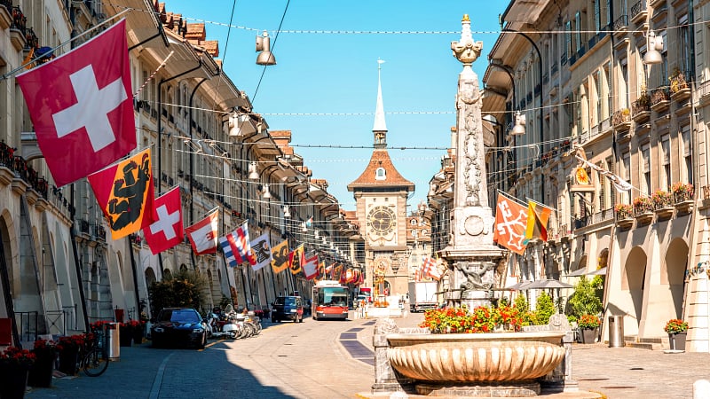Kramgasse, a famous historic street located in the Old City of Bern, Switzerland, which is designated as a UNESCO World Heritage Site.