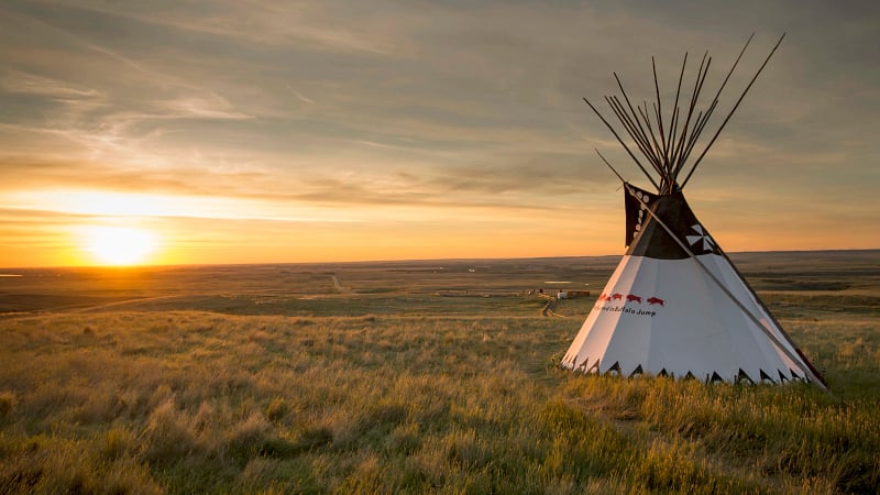 A traditional Blackfoot tipi overlooking the plains at the Head-Smashed-In Buffalo Jump World Heritage Site, located near Fort Macleod in Alberta, Canada